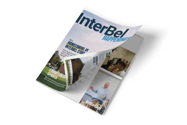 Magazine mockup featuring InterBel Happenings.